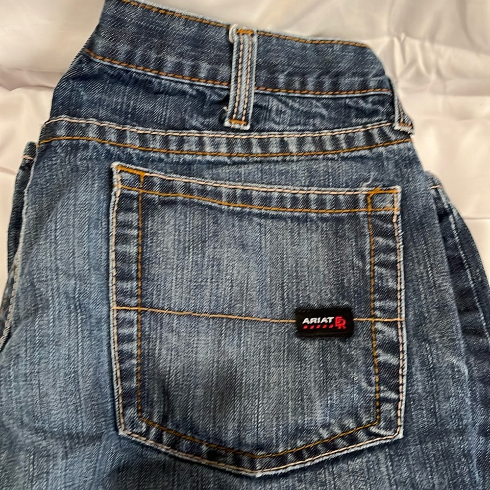 2 pairs of Arita low rise M4 boot jeans that are not hemmed